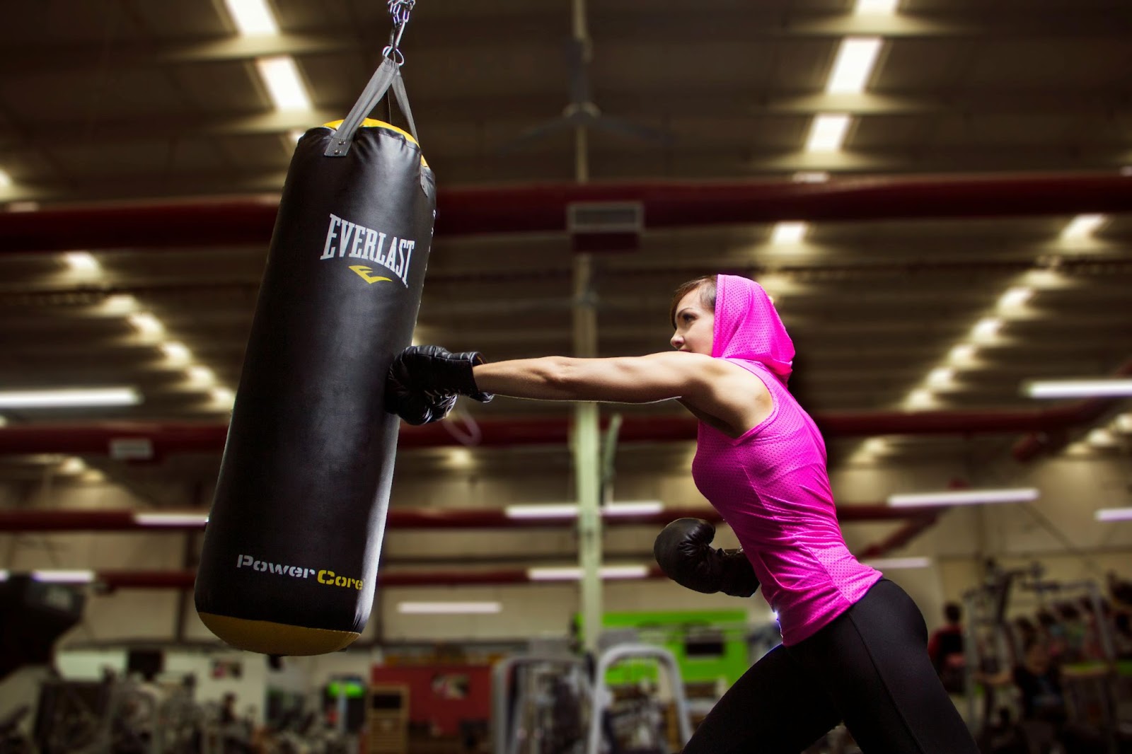 A woman punching a punching bag