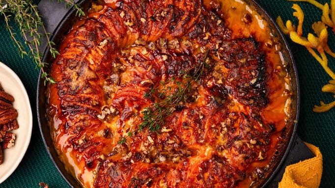 Sweet Potatoes Au Gratin in a black dish.