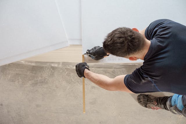 person repairing flooring