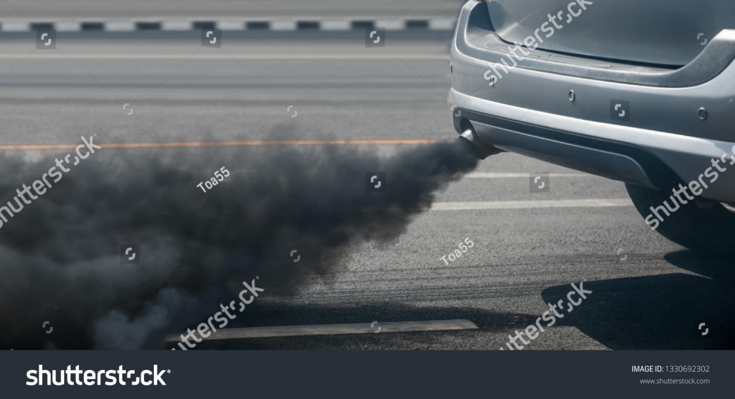 air pollution crisis in city from diesel vehicle exhaust pipe on road