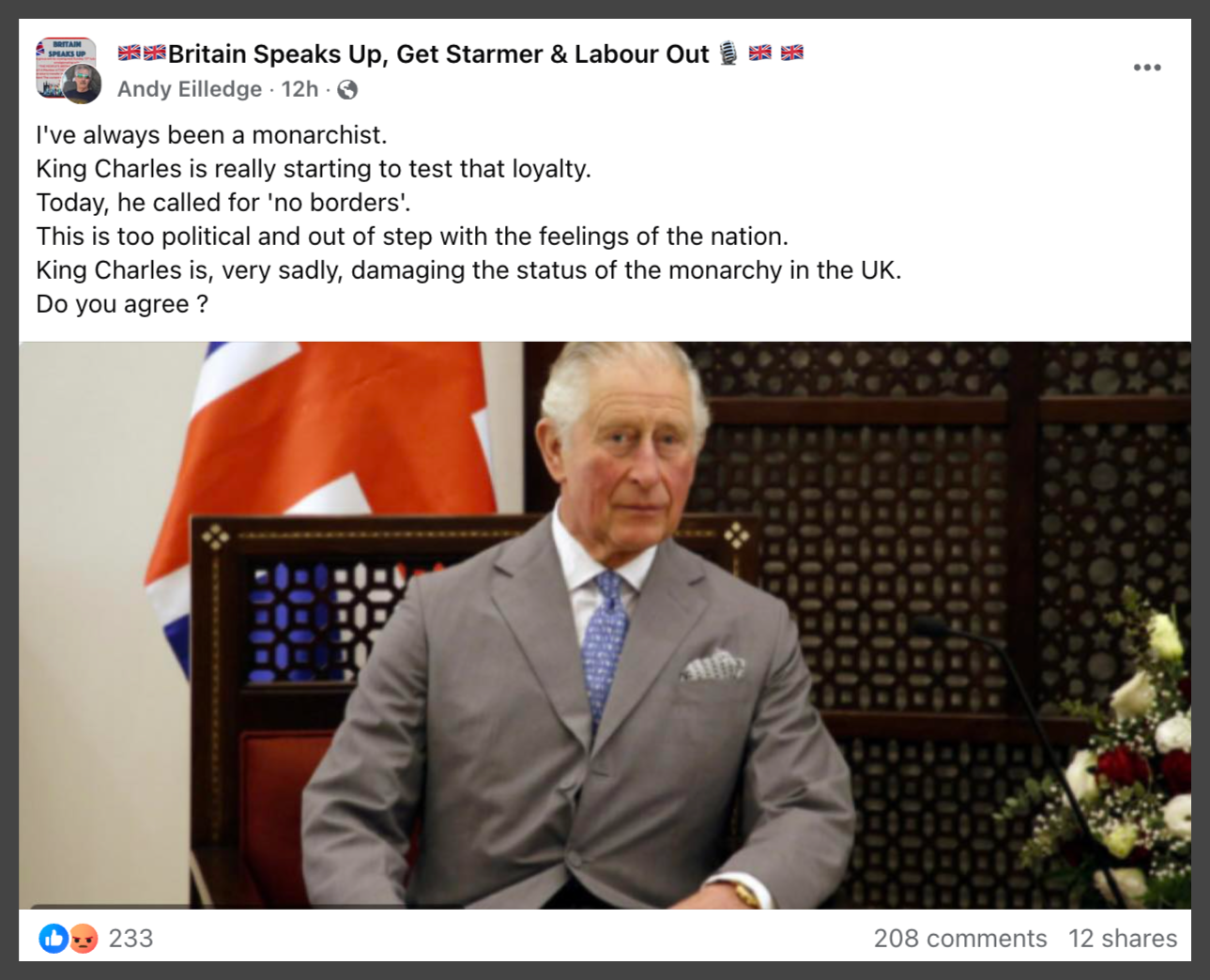 A person in a suit sitting in a chair

Description automatically generated
