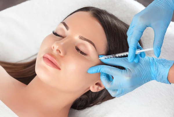 A woman having dermal fillers