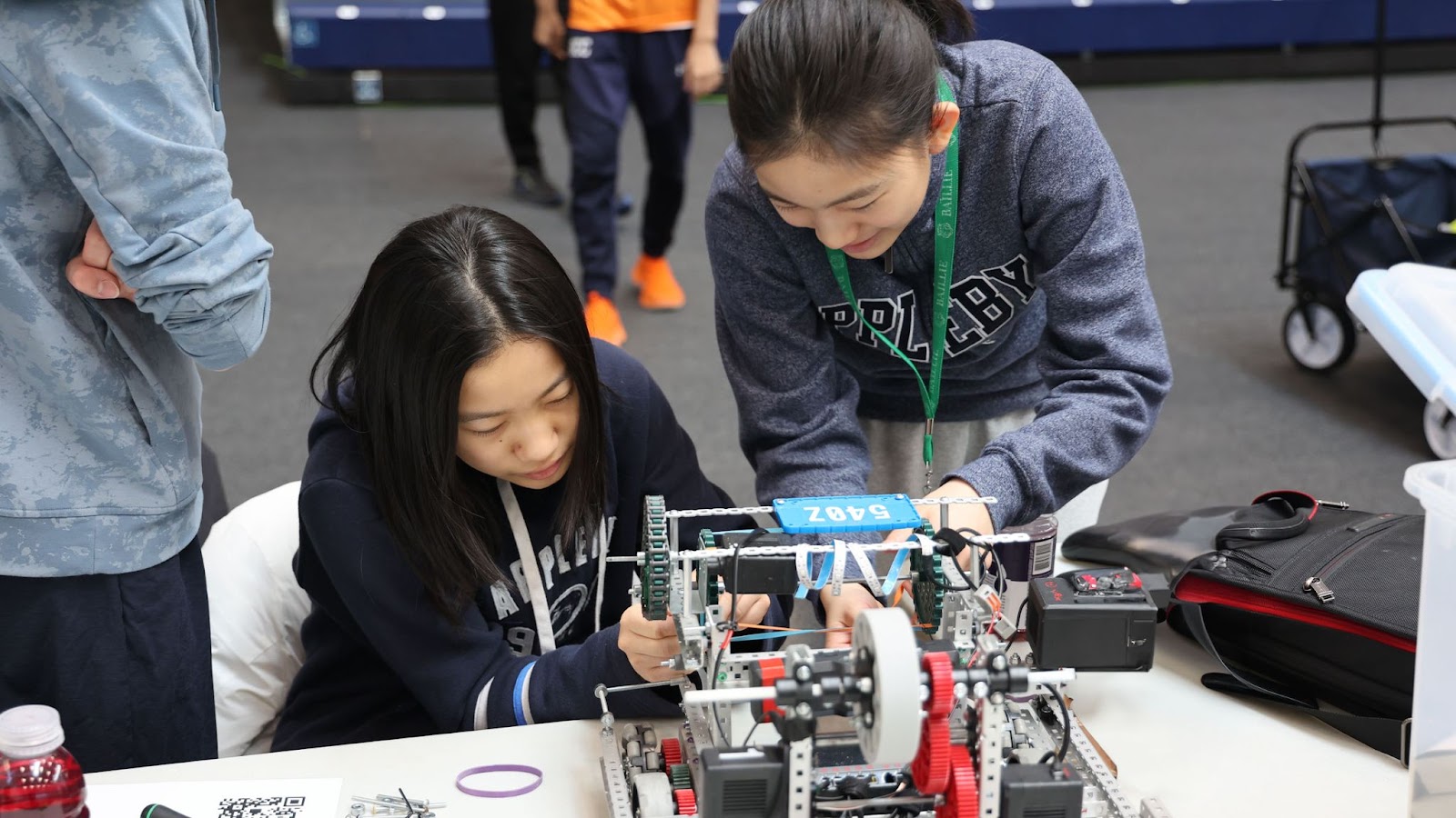 two students working on robotics