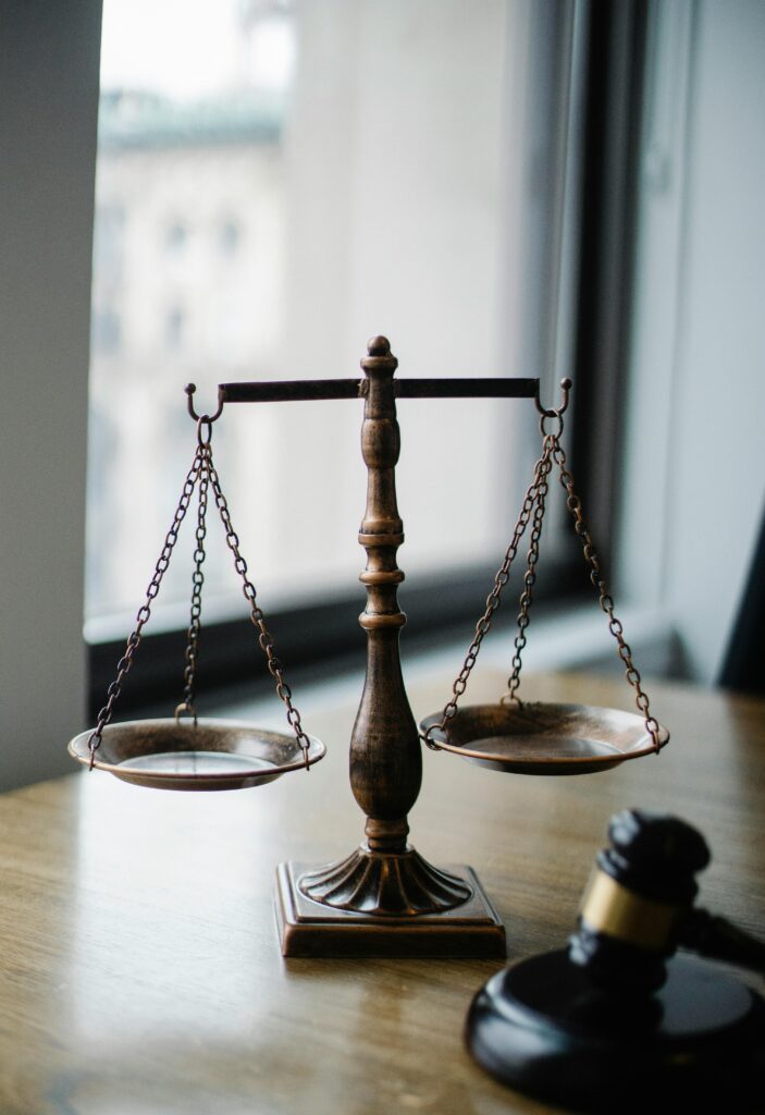 a justice scale and gavel on a Chester County nursing home neglect lawyers's desk