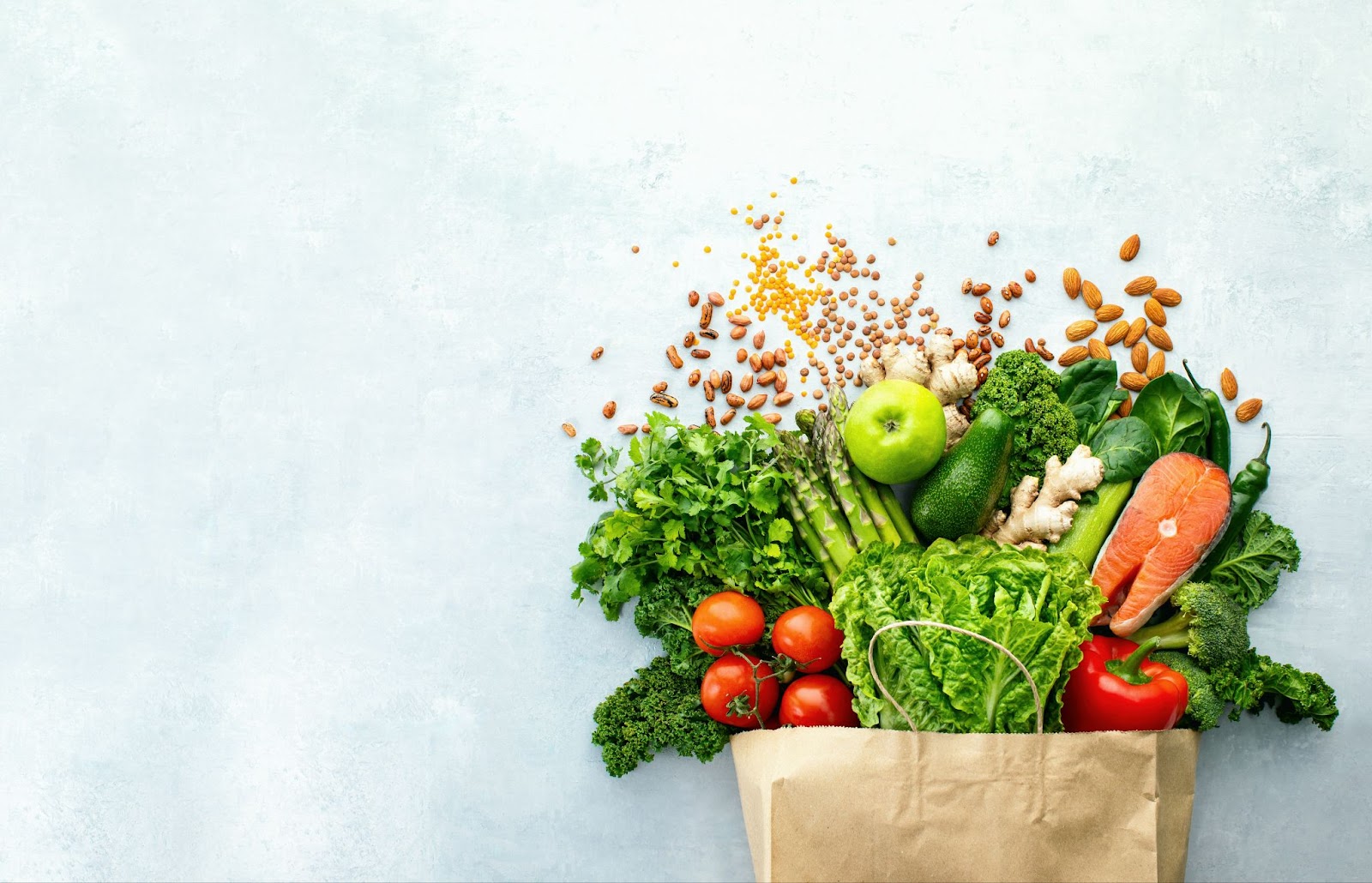 a grocery bag full of assorted healthy foods that support the delayed onset macular degeneration.
