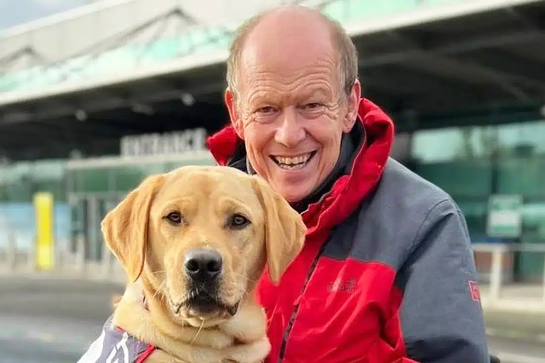 Photograph of Allen Parton and his service dog Endal