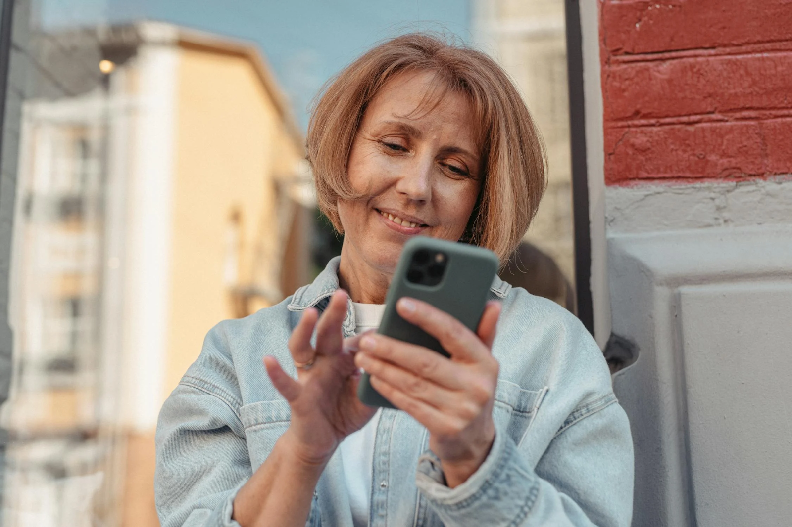 User interacting with a mobile-friendly interface, highlighting the importance of responsive UI/UX design for Websites.