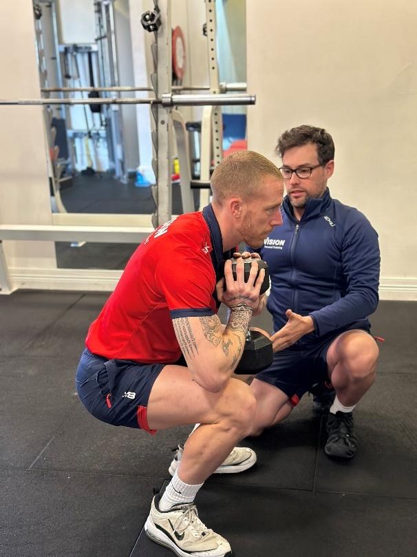 a Vision PT personal trainer performing goblet squats