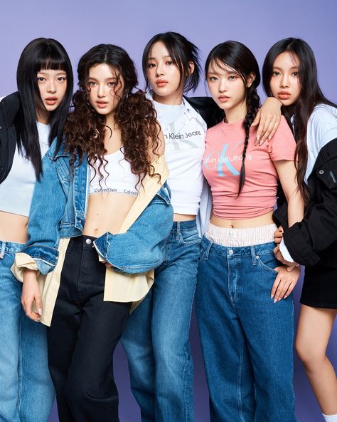 This contains an image of NewJeans posing together in denim outfits