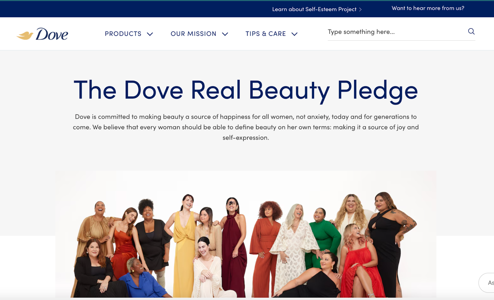 A screenshot of Dove's website on their "The Dove Real Beauty Pledge" which has an image of a diverse number of female presenting people smiling together with the paragraph "Dove is committed to making beauty a source of happiness for all women, not anxiety, today and for generations to come. We believe that every woman should be able to define beauty on her own terms: making it a source of joy and self-expression."