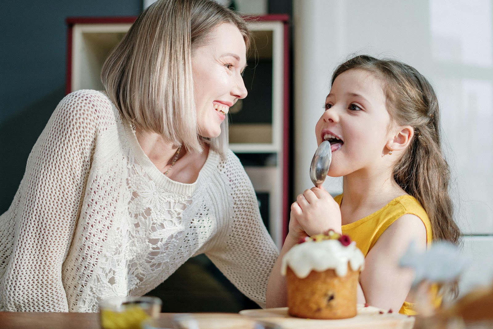 A mother cooking with her daughter | Source: Pexels