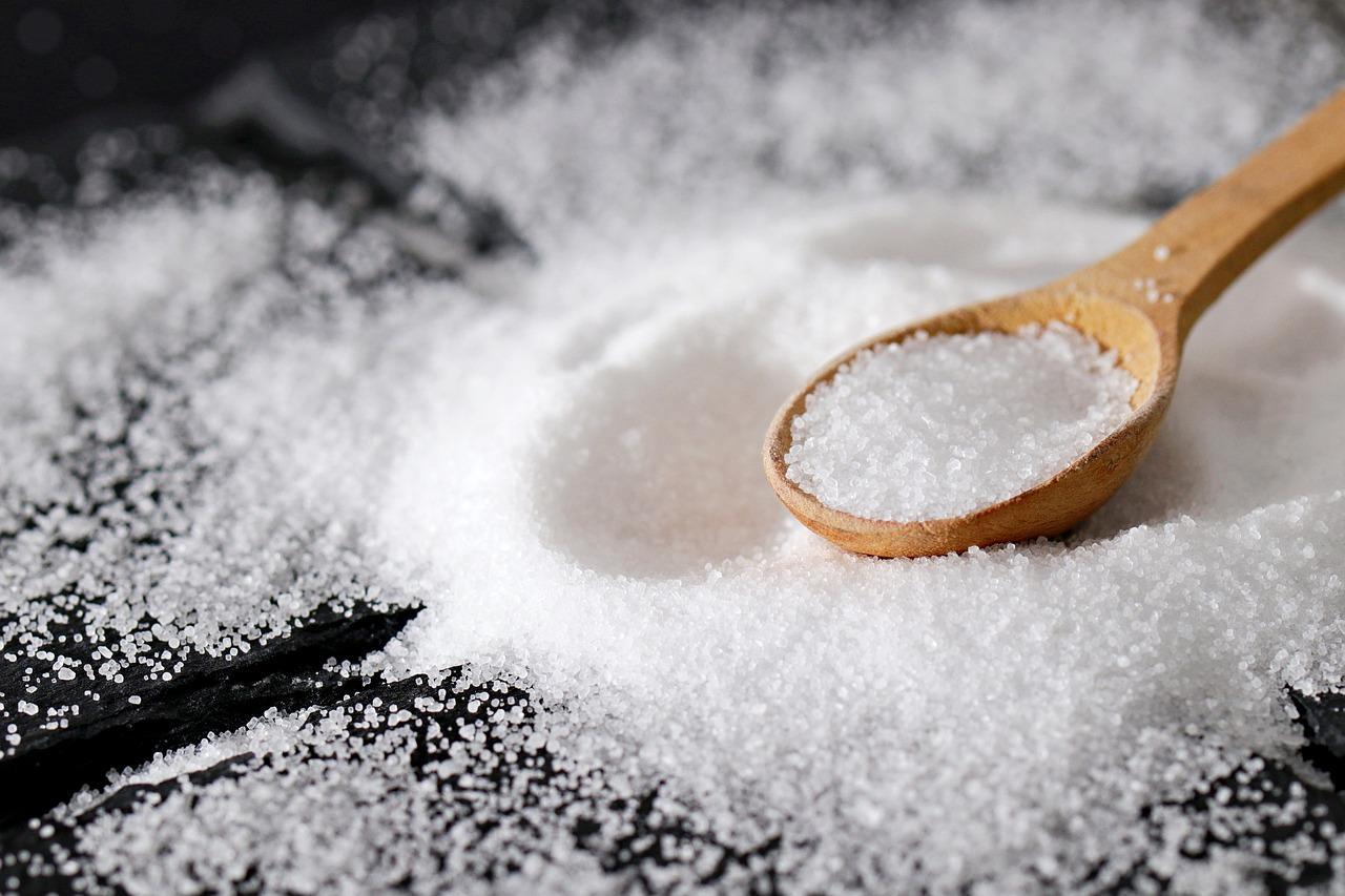 Salt in a wooden teaspoon with salt 