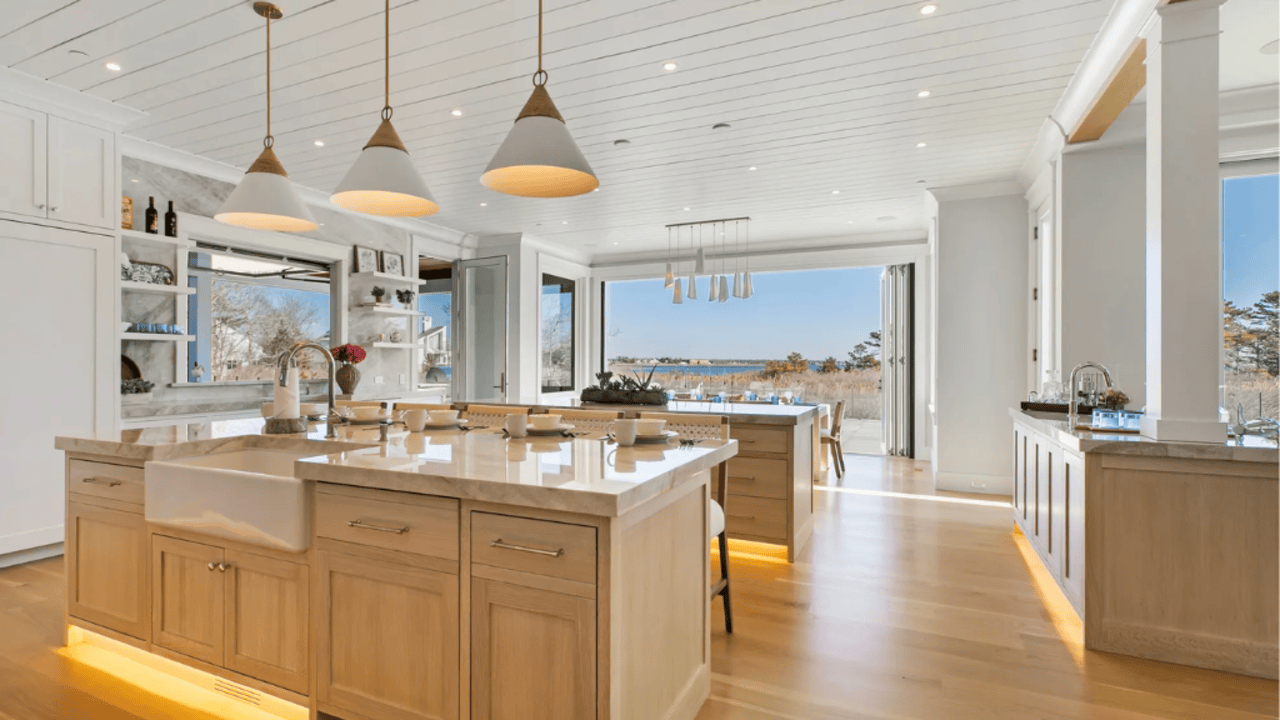 Tour This 8,094 Sq Ft Shingle-Style Waterfront Estate in Quogue, NY with Floating Staircase and 300-Bottle Wine Cellar