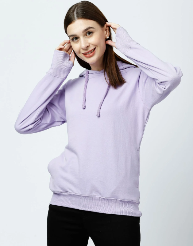 Model wearing Kosha pullover hoodie sweatshirt an essential piece of cold weather digital nomad gear for comfort and layering.