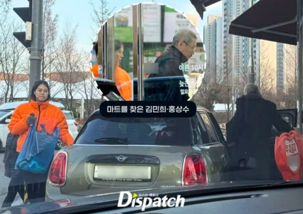 This contain an image of Actress Kim Min Hee's and Hong Sang-soo Dispatch revealed intimate details of the couple's daily routine through exclusive photographs. Kim Min Hee handles the driving responsibilities while Hong accompanies her on errands and shopping trips