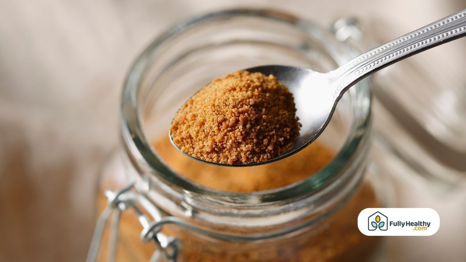 Spoonful of brown sugar over glass jar
