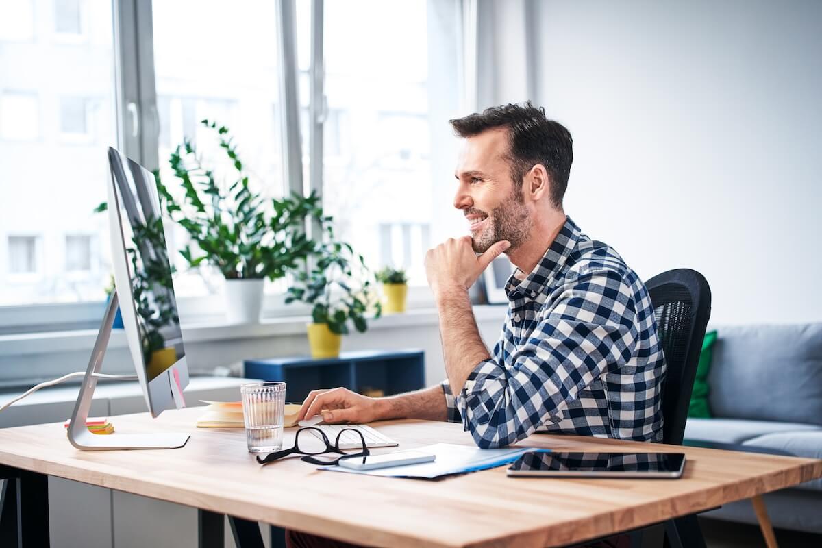 Employee happily using a computer