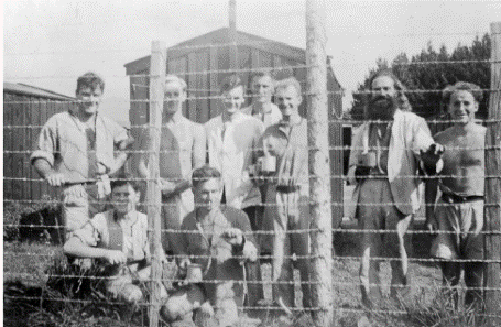 A group of men posing for a photo 
Description automatically generated