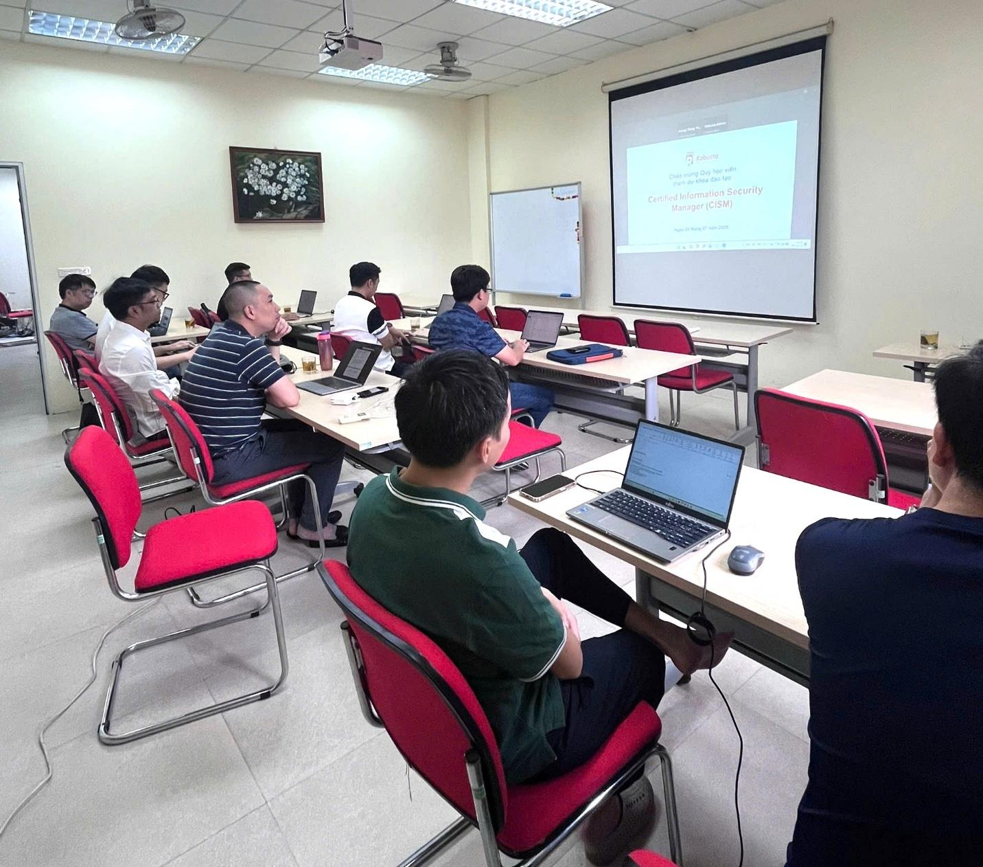 A group of people sitting in a room with laptops

AI-generated content may be incorrect.