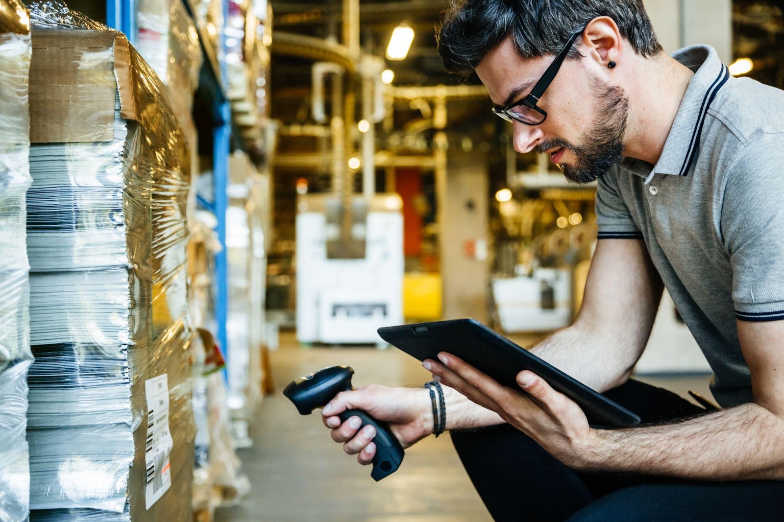 Worker scanning inventory