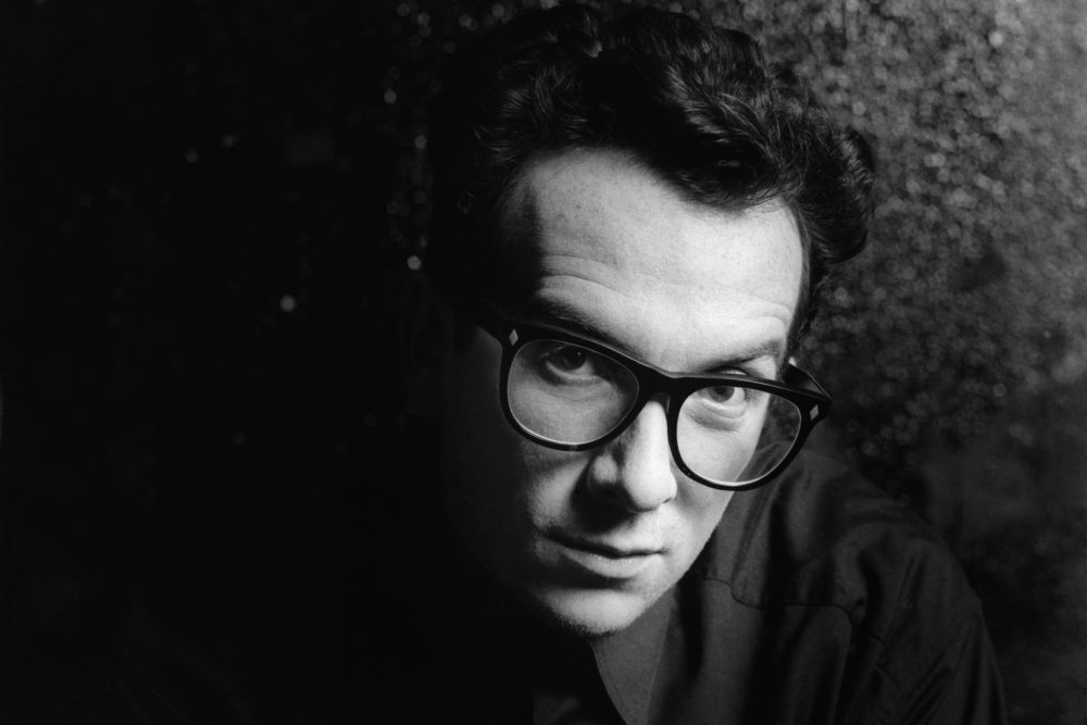 UNITED KINGDOM - JANUARY 01:  Photo of Elvis COSTELLO; studio, posed  (Photo by Estate Of Keith Morris/Redferns) age 70 best songs