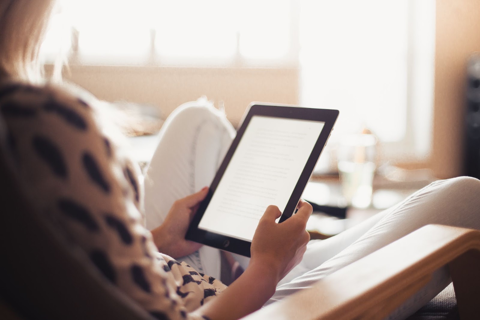 A lady applying text: book launch strategy while building your brand