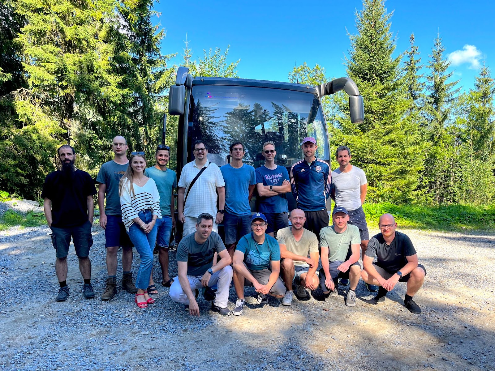 The team pose for a photo in front of the bus, ready to leave from Brno for the primehammer team building.