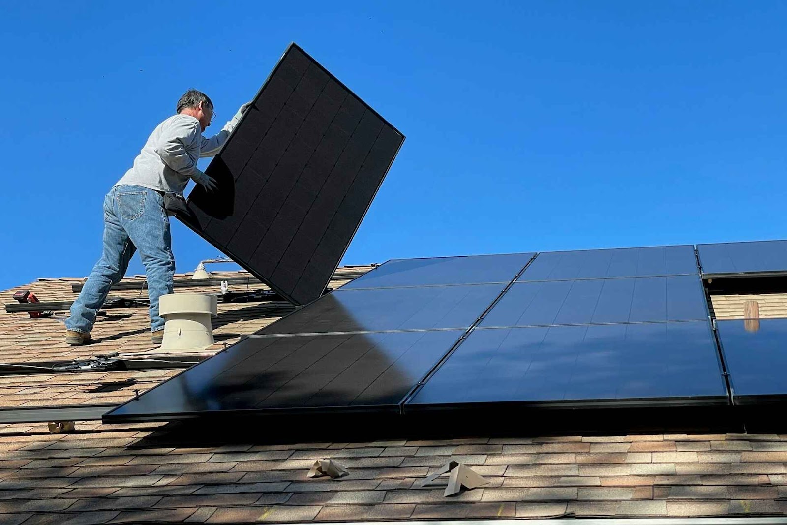 Man installing a renewable energy source. 