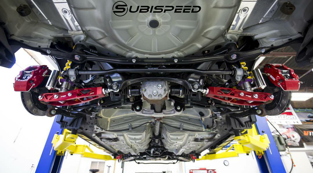 Aftermarket rear lower control arms on a Subaru WRX