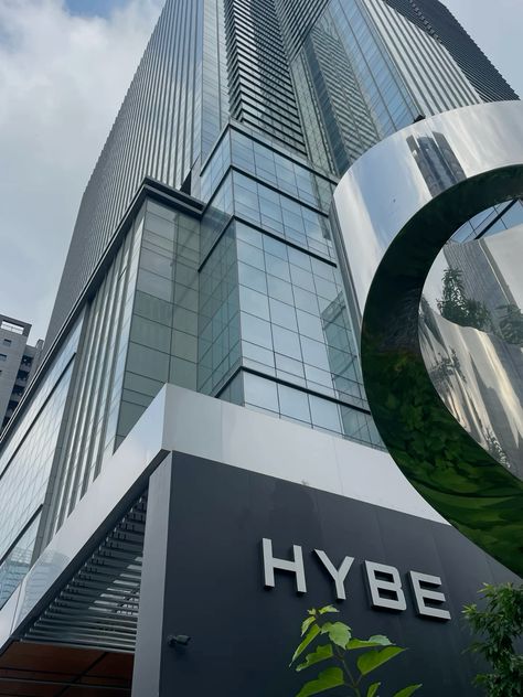 This contain: the hybe building in sydney, australia is one of many high rise buildings