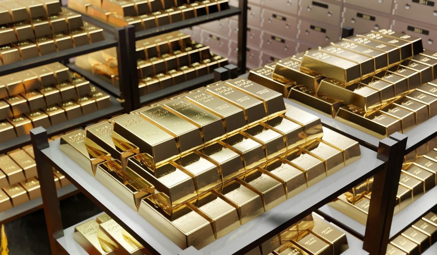 Stacks of gold bars on shelves

Description automatically generated