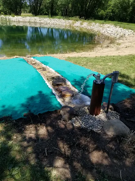 Submersible Solar Well Pump filling Pond