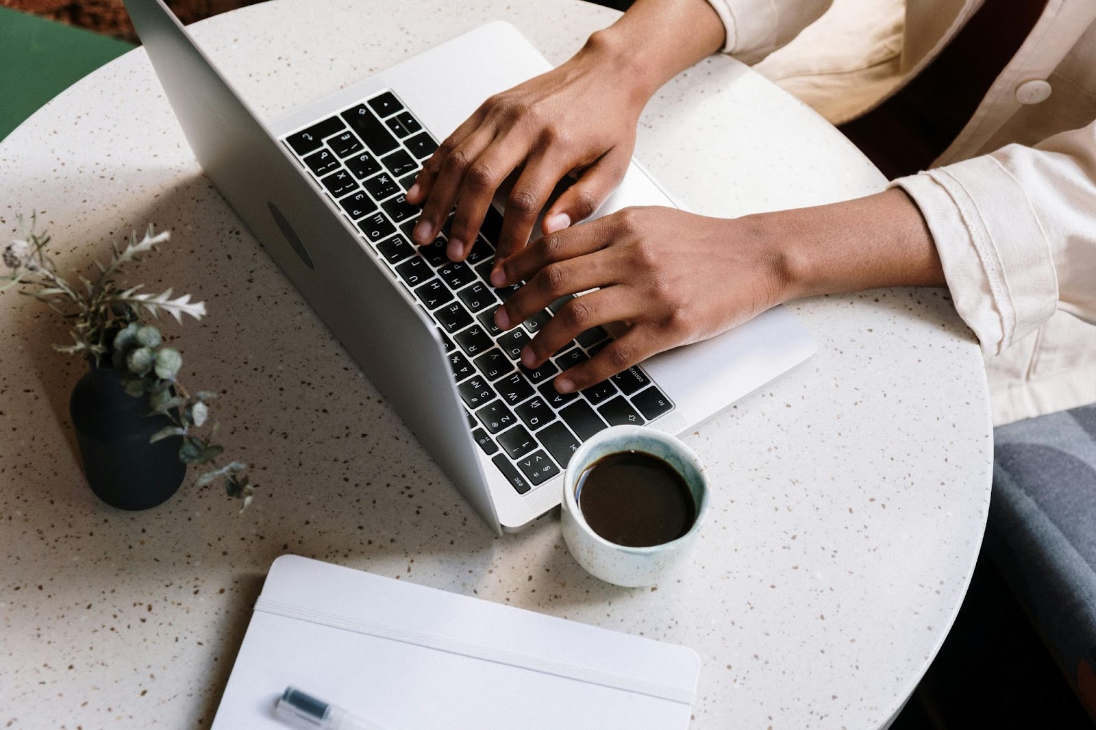 image of a lady typing on a laptop