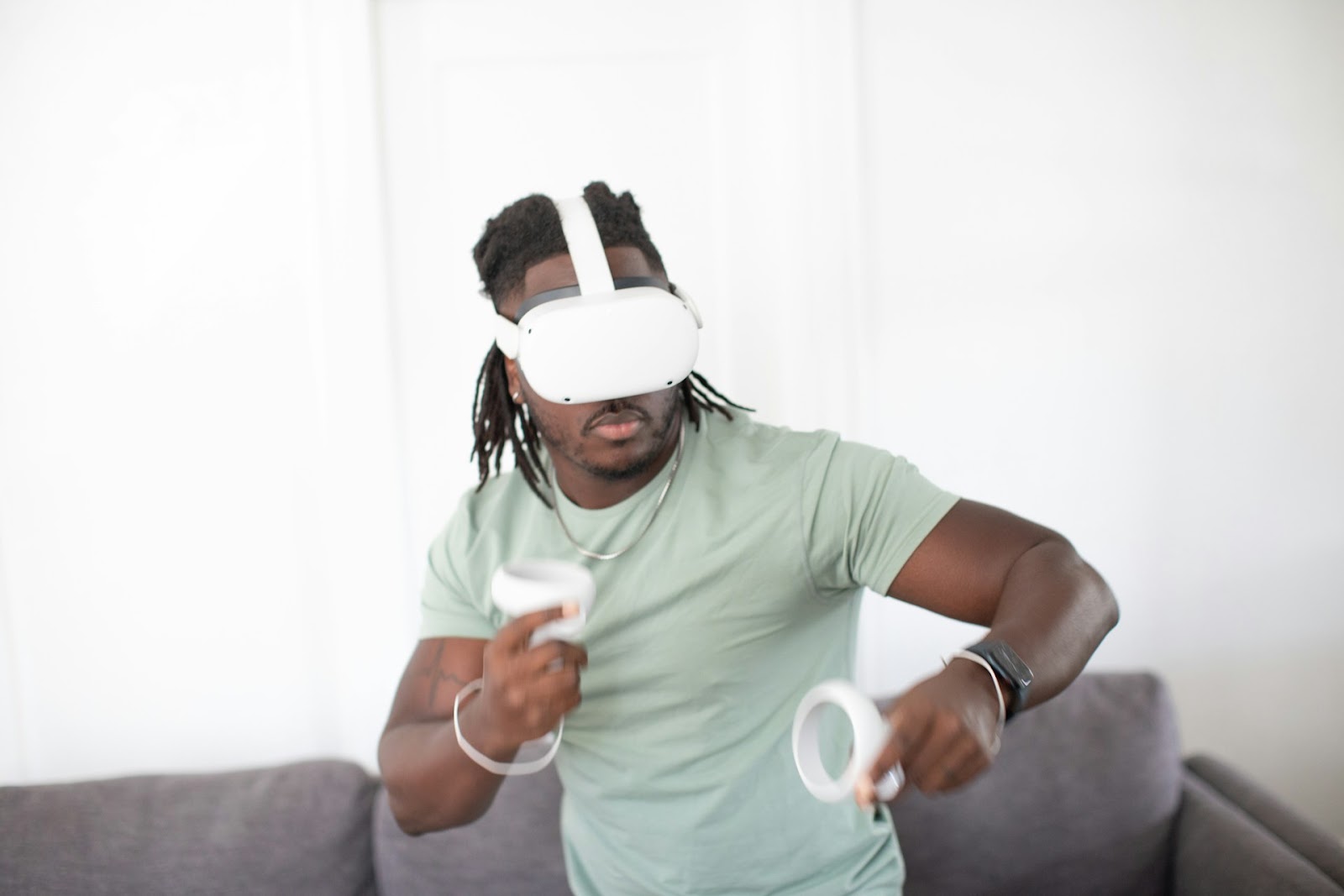 a person wearing a white mask and holding a white object.