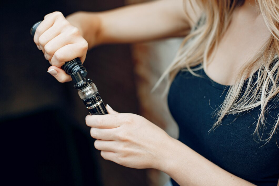 women recharging disposable vape