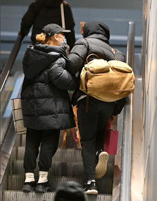 Ariana Grande and Ethan Slater hold hands, carry gifts at NYC airport