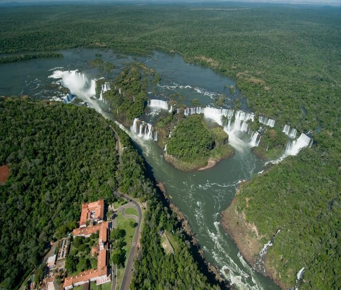 Aerial view of a river with a waterfall

Description automatically generated