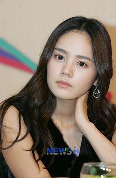 This contain an image of Han Ga putting on black dress