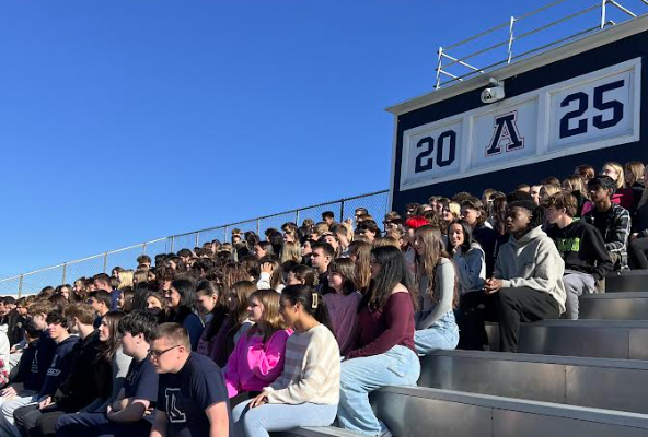 image of the class of 2025 sitting on the bleachers