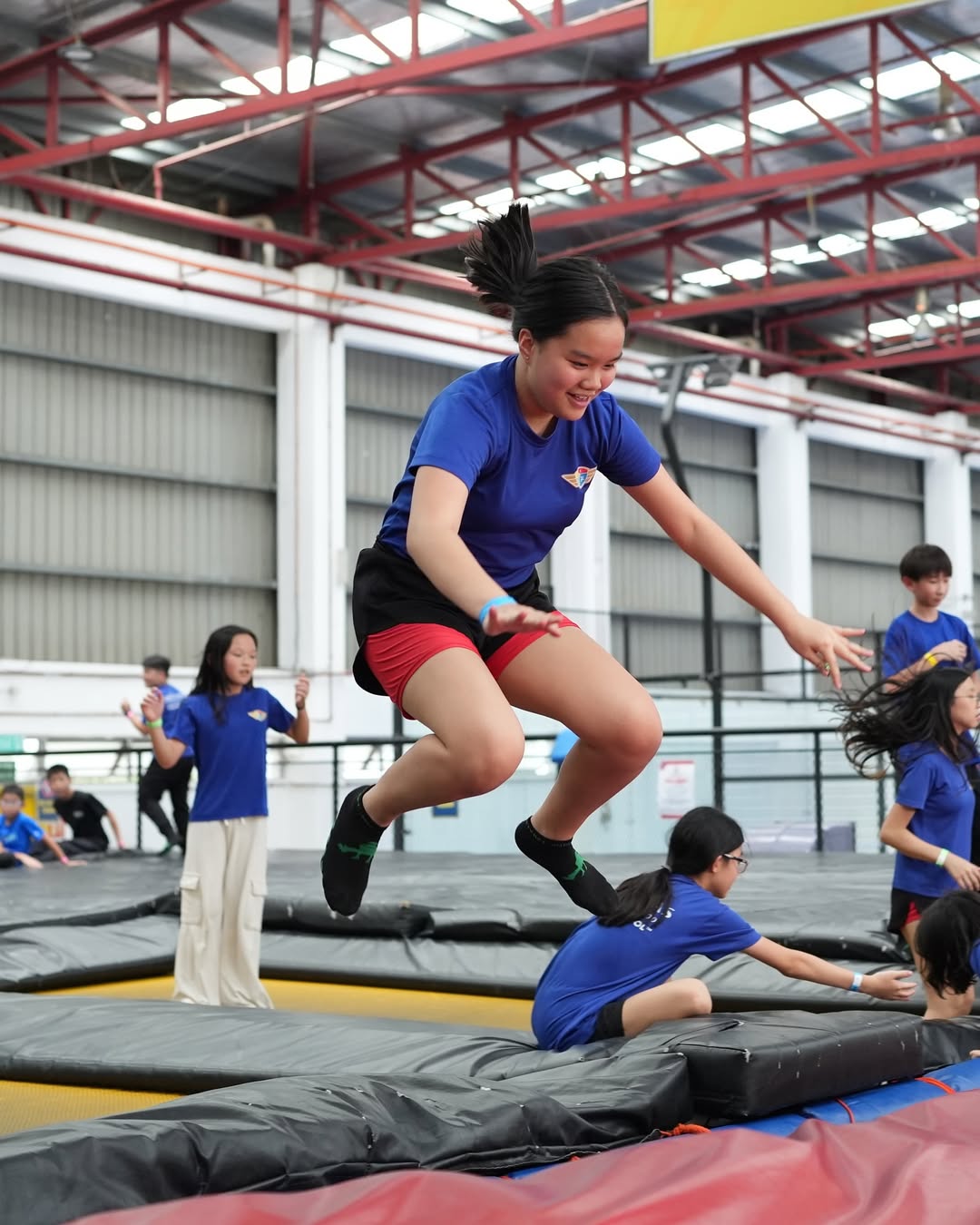 girl jumping in Jump Street Asia, one of the most fun activities in kl