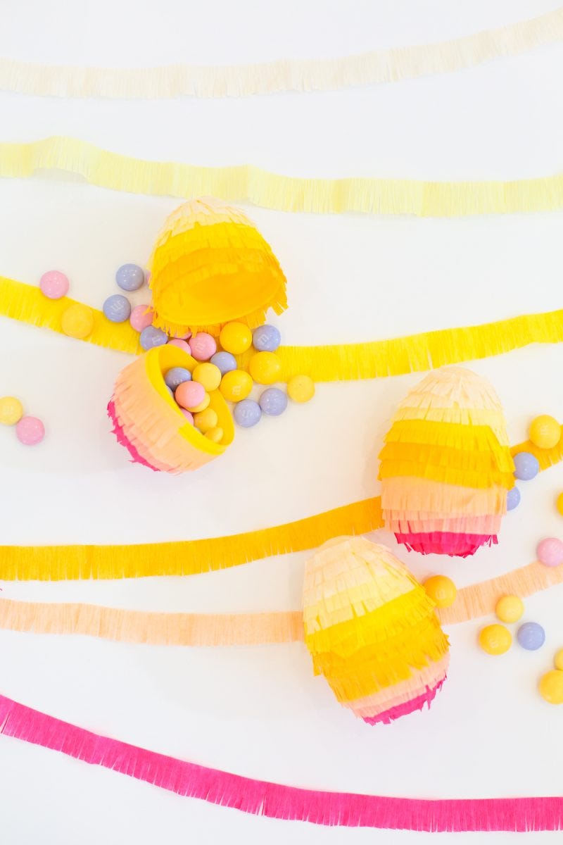 plastic eggs decorated to look like piñatas