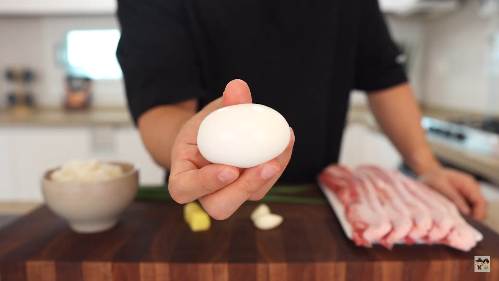 Aaron preparing ingredients for their Butadon recipe in a home kitchen