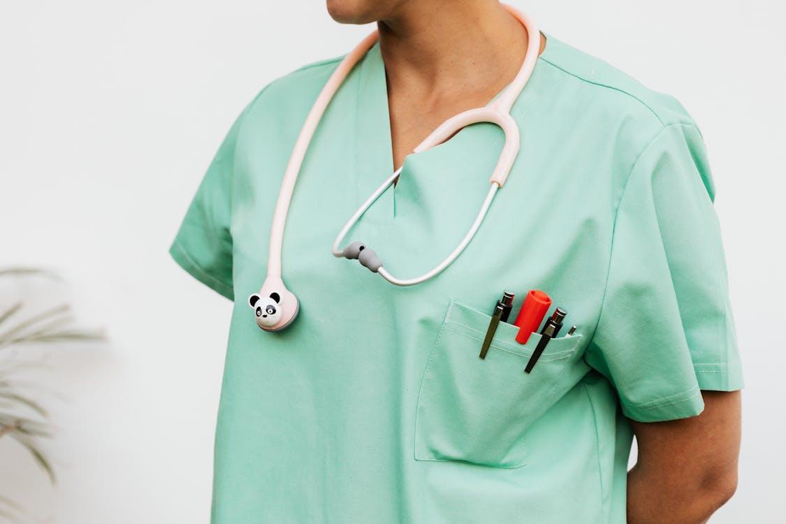 Free 
A Doctor in a Scrub Suit with a Stethoscope Stock Photo