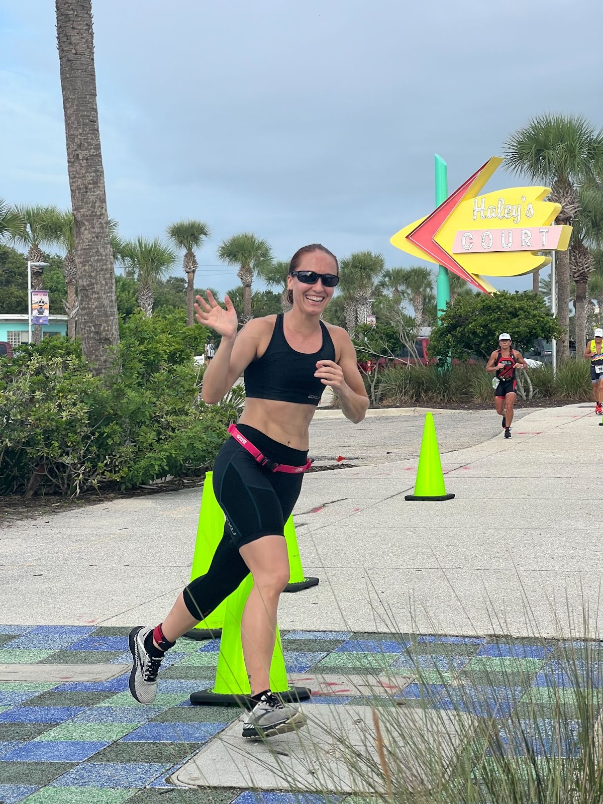 Cortney Welch Running at the end of a triathlon