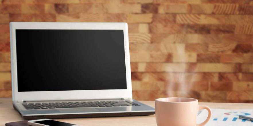 Regular Breaks (20-20-20 Rule). A laptop turned off with a cup of hot liquid