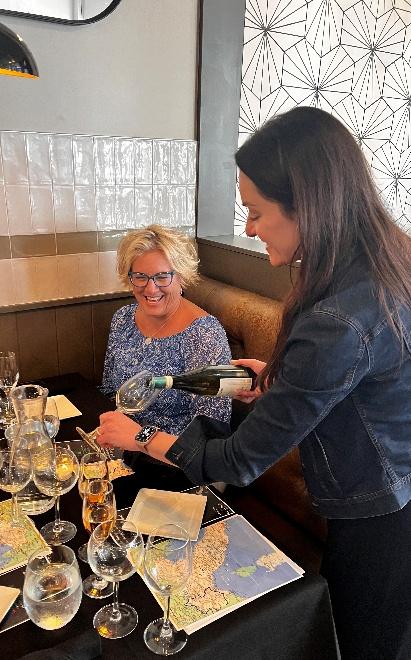 A person pouring wine into a glass

AI-generated content may be incorrect.