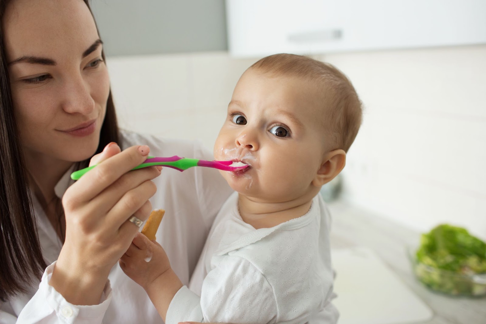 Mother feeding her child