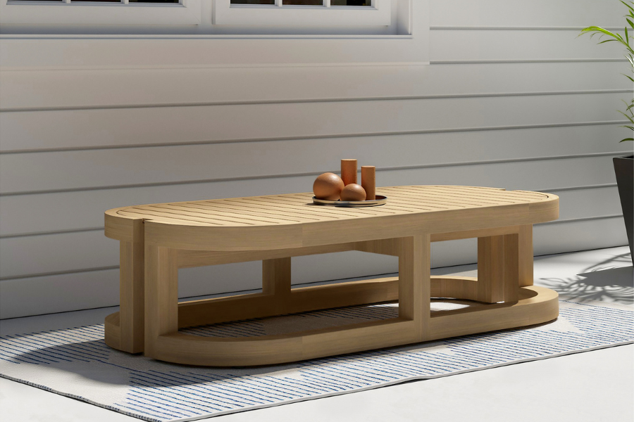 Sarpa Acacia Wood Outdoor Patio Coffee Table with a sculpted teak-inspired frame and slatted top—crafted for stability, style, and functionality in modern outdoor living spaces.