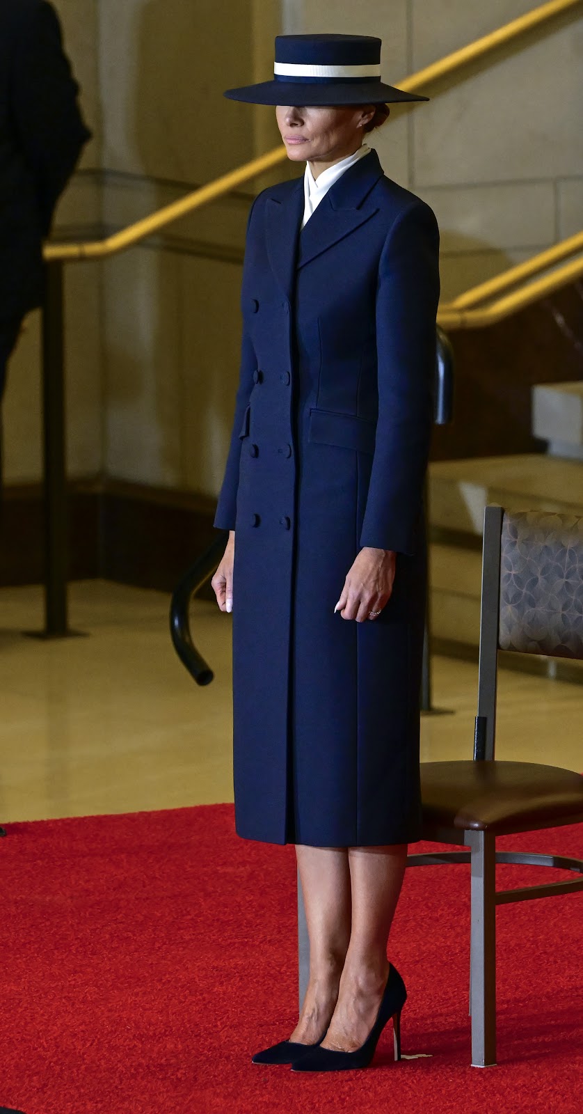 Melania Trump looking on as Donald Trump participates in a Reviewing the Troops Ceremony. | Source: Getty Images