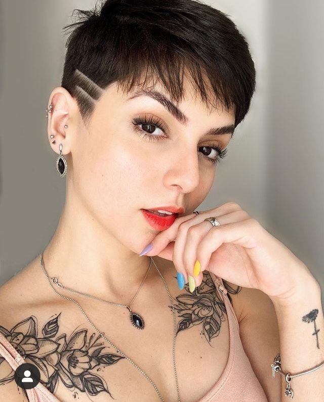 a lady wearing bold lipstick rocking a pixie cut